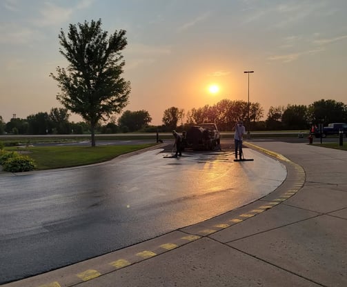 e-and-h-asphalt-crew-working-on-a-seal-coating-project.jpg