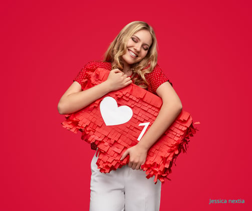 a woman holding a pinatable shaped pinatable