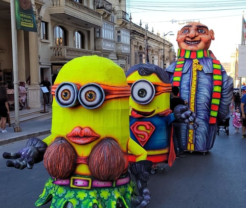 Carnival floats in Victoria, Gozo. Two minions followed by Gru.