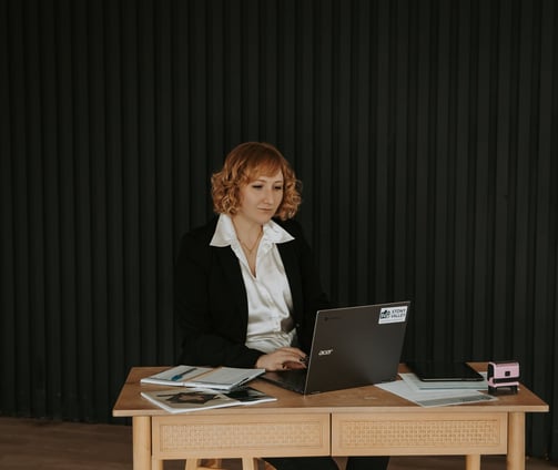 Stony Valley Employee at a desk with a laptop working.
