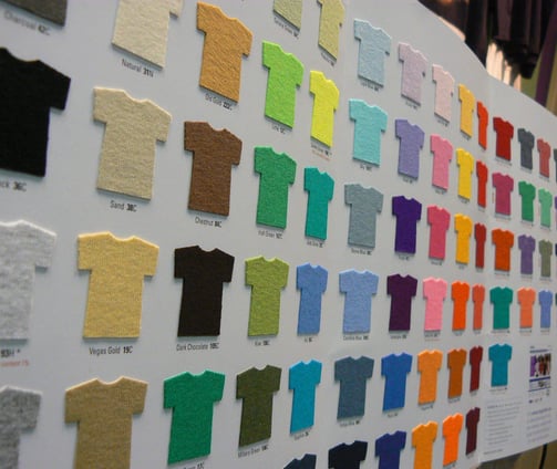 a large display of a variety of different colored shirts