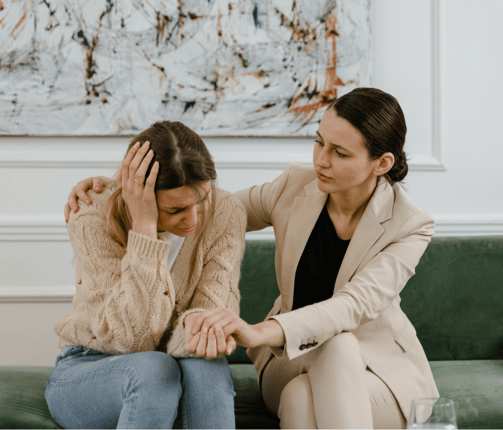 woman supporting another woman through a difficult time