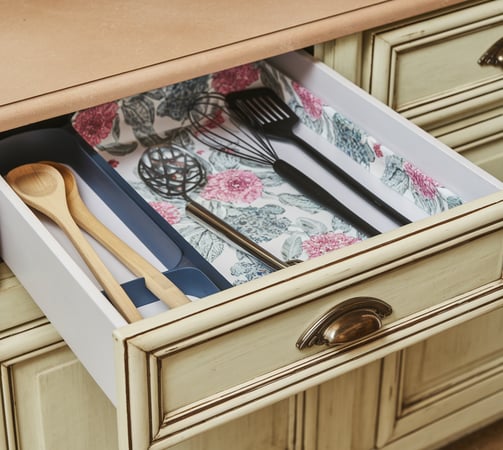 a drawer with utensils in it