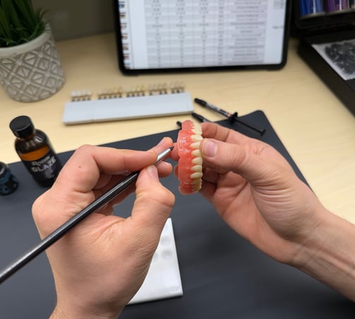 Picture with the process of crafting digital denture.