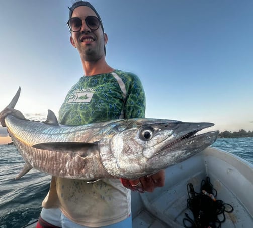 Proud angler with a King Fish caught during a Half-Day Fishing Charter in Zanzibar