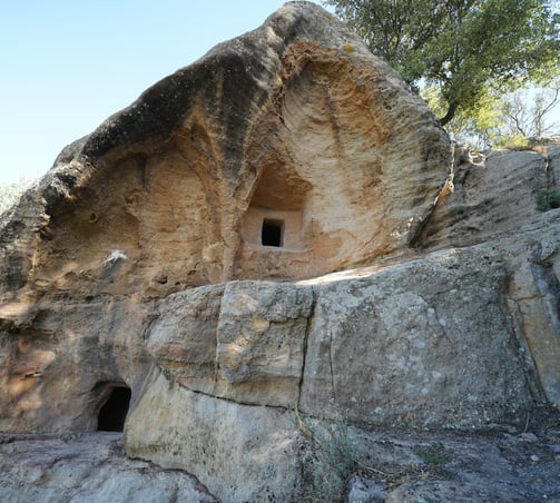 a cave in a cave with a cave in the background