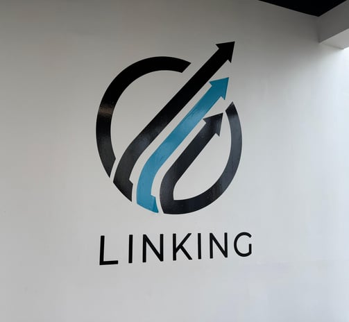 a logo on a wall of a building