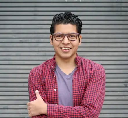 a man in a red shirt and glasses