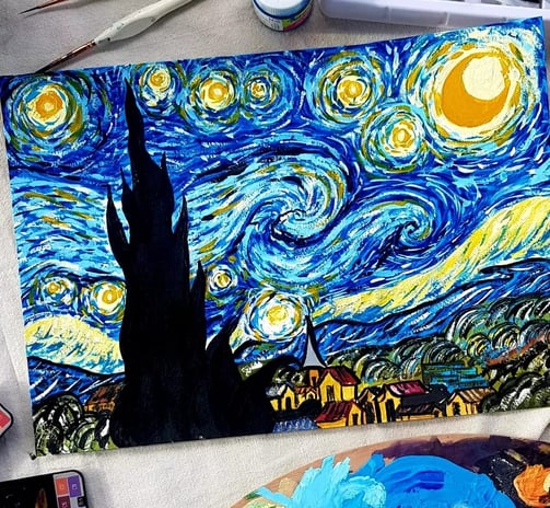 alt="Van Gogh's Starry Night painting featuring a swirling night sky over a quiet village"