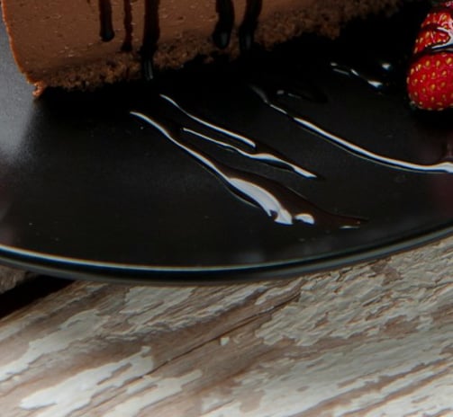 a chocolate cake with strawberries dessert in the restaurant table.Hospitality Startup Guidance