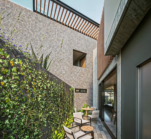 terraza de casa con materiales de piedra, concreto y piedra