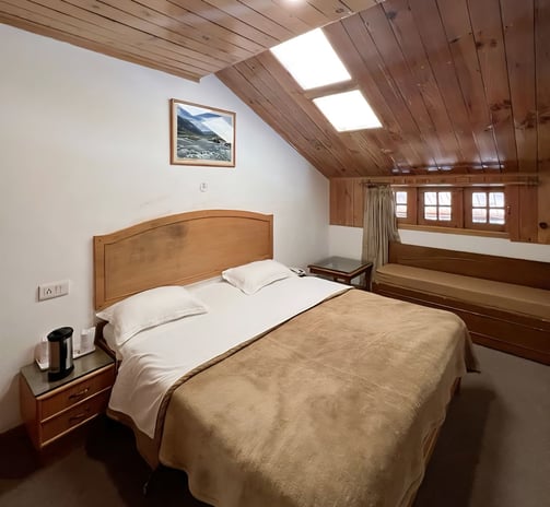 Deluxe Family Type Room In Manali with Traditional Wooden Finishing