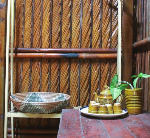 Simple yet airy room facing an open courtyard with rustic wood and nature all around.