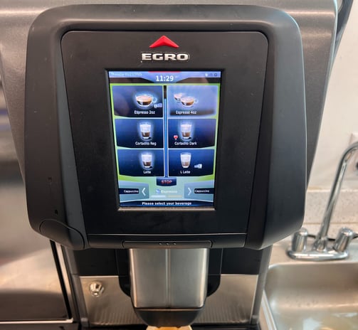Egro super-automatic espresso machine preparing a cup of coffee.