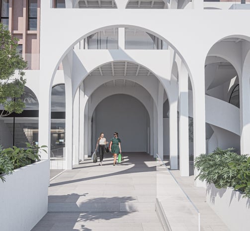 a group of people walking through a building