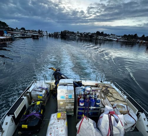 a boat with a lot of bags of food