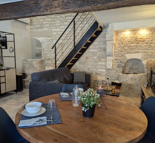 a dining room table with a table and chairs