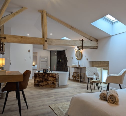 a bedroom with a bed, chair, and a desk