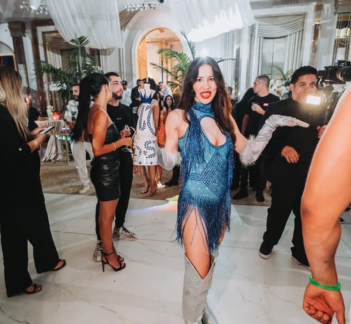 a woman in a blue dress and a man in a suit and tie