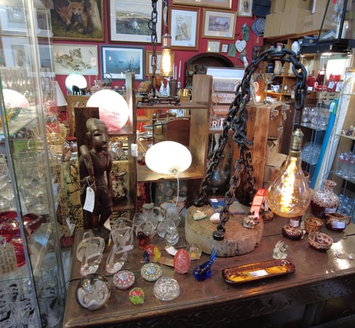 Chain light and curios  @jkfarm.co.uk chain light, paper weights,  Africana,  carved statue 