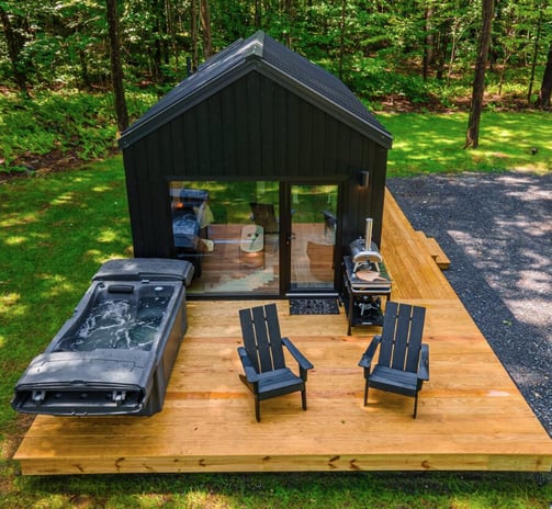 Tiny home pod with deck, hot tub, and outdoor seating