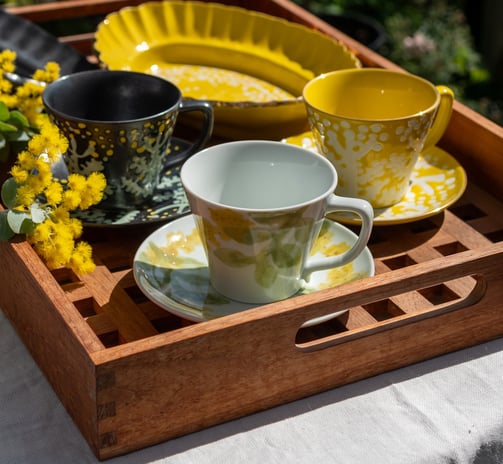 A tray with a cups from hand-made products available on Sedoya website