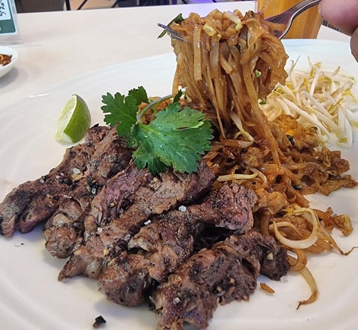 a plate of food with noodles and noodles