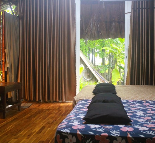 Spacious twin-bed room with large windows overlooking the tropical vegetable garden.