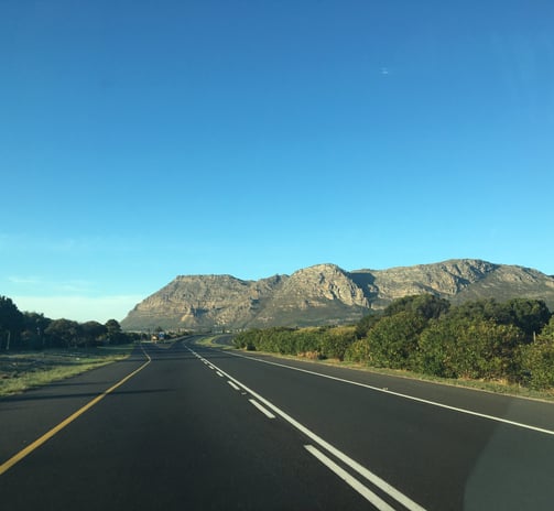 clean street with mountains in backround