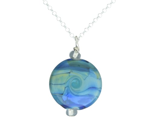 a blue and white glass bead necklace with a blue swirl