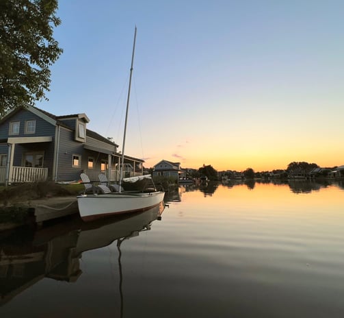 a boat on the water at sunset. Zuytland-Buiten Simonshaven, Zuid-Holland