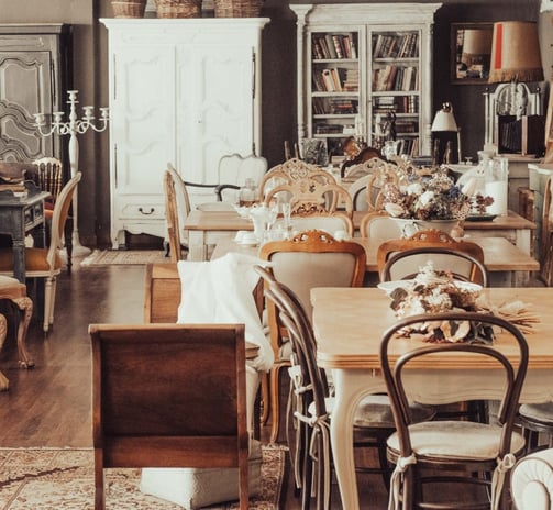 a room with a table and chairs and a table
