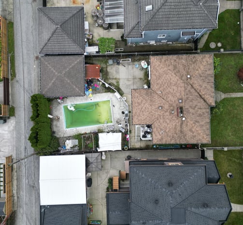 a house with a pool and a tennis court