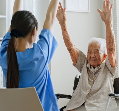 a woman in a wheelchair is doing yoga exercises