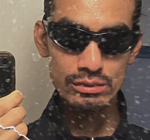 a man in sunglasses and sunglasses taking a selfie