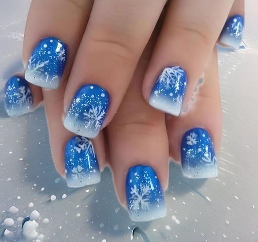 Uñas azules con copos de nieve