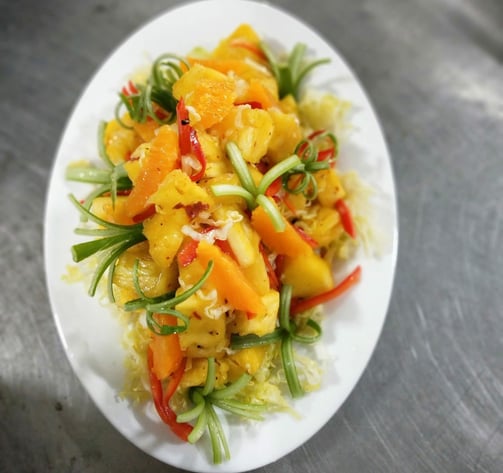 a plate of food with a salad on it