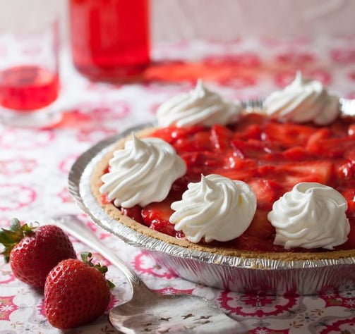 a pie with whipped cream and whipped cream