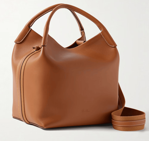 Luxury tan leather handbag with a structured silhouette and contrast stitching.