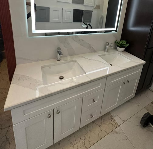 a bathroom with a large mirror and a chandelier