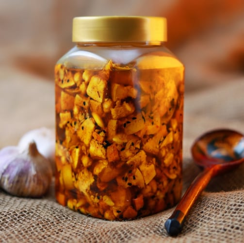 a jar of pickled garlic garlic oil