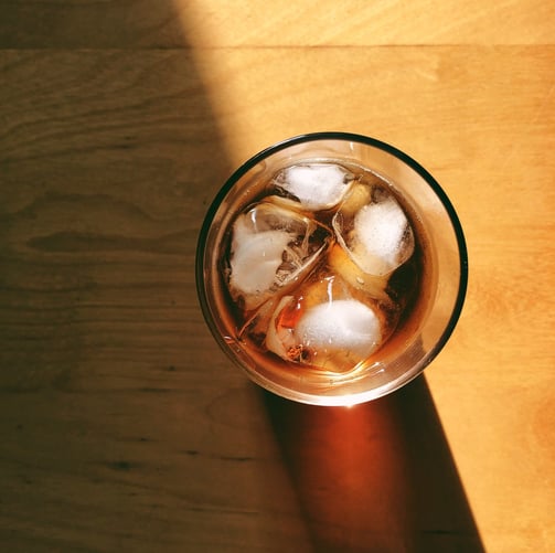 a glass of coffee with ice