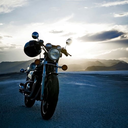 a motorcycle parked on the side of a road