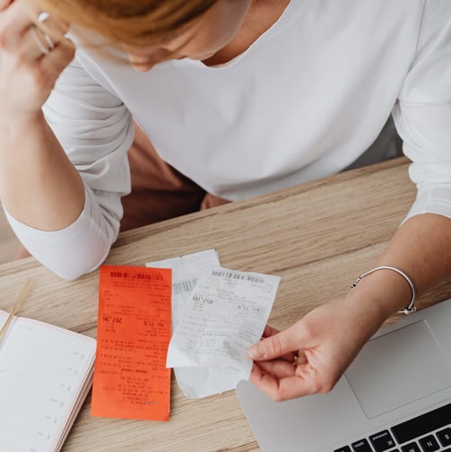 business-women-stressing-over-receipts-and-bookeeping