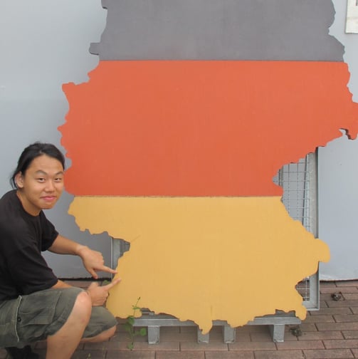 a man is holding a map of germany