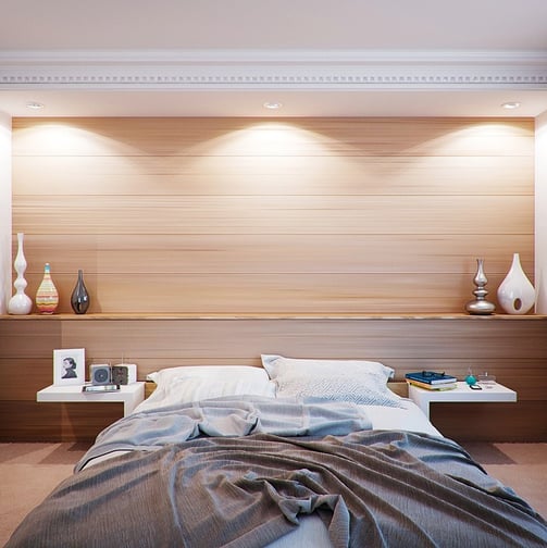 a bedroom with a bed in the middle of the room