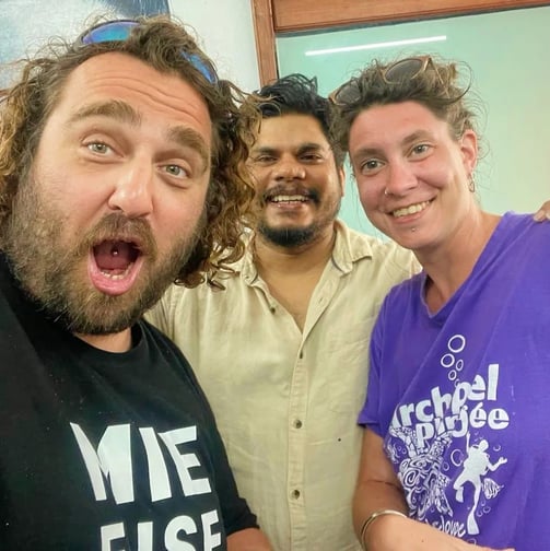 About us page shows a fun image of tattoo artist Raja Natraj in the tattoo studio with his clients.