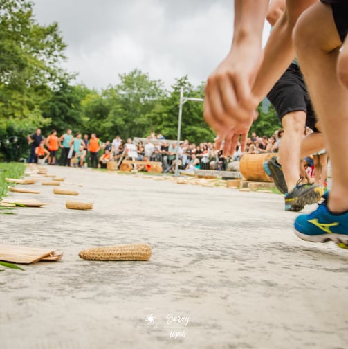a person is running on a path with a lot of people