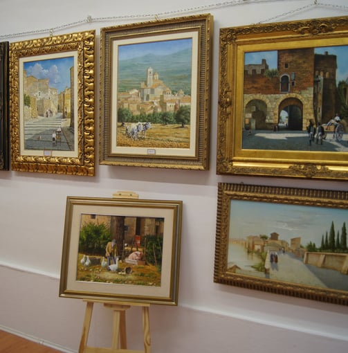 a wall of paintings of paintings of paintings of paintings of people