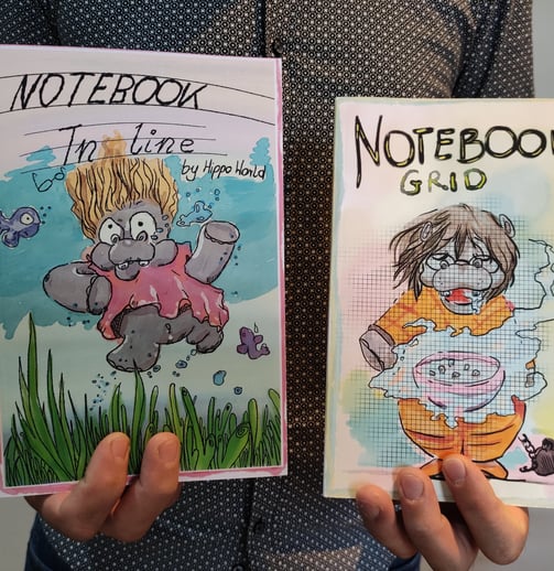 a person holding a notebook with a notebook and notebook